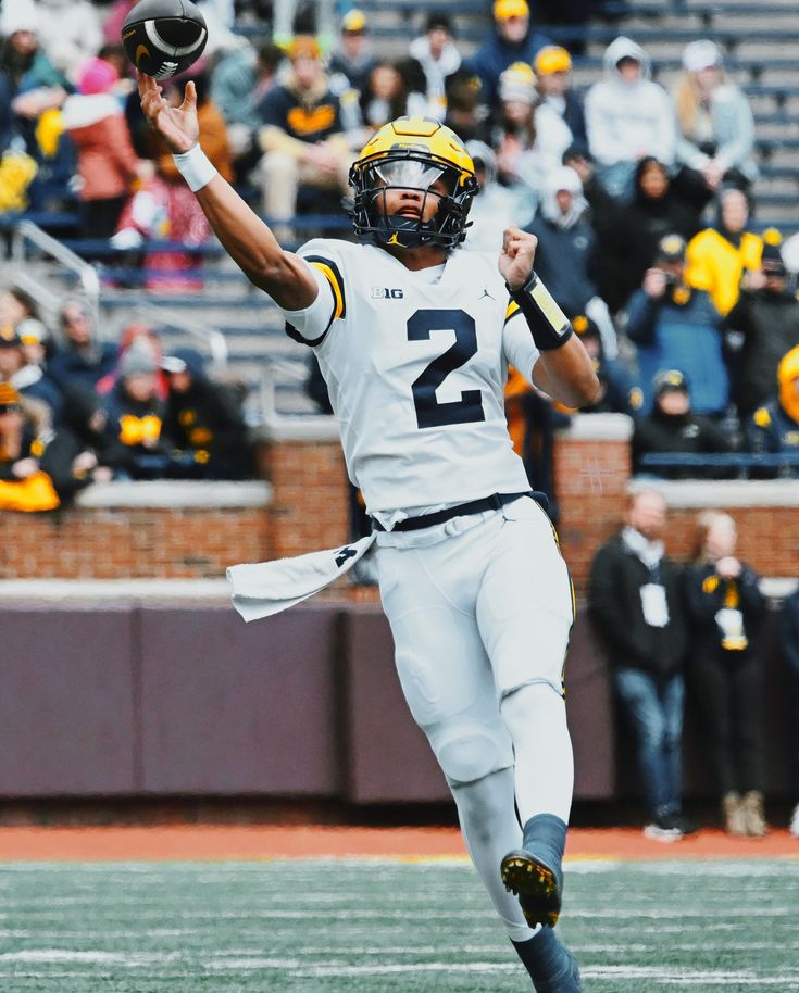 a football player throwing a ball in the air