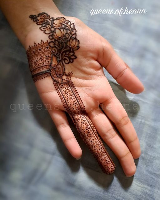 a person's hand with henna on it