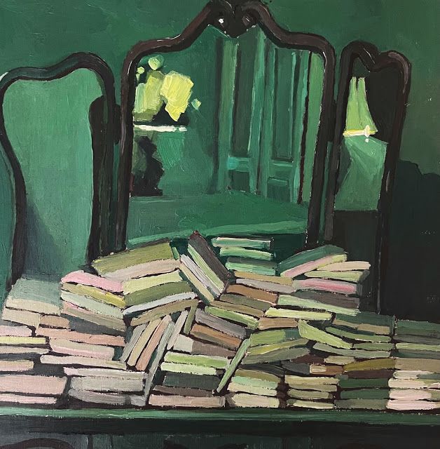 a pile of books sitting in front of a mirror