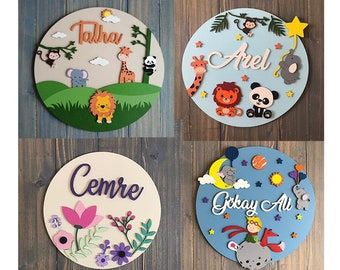 four circular magnets with animals and words on them, all painted in different colors