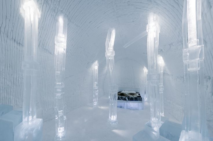 an ice hotel with white walls and columns