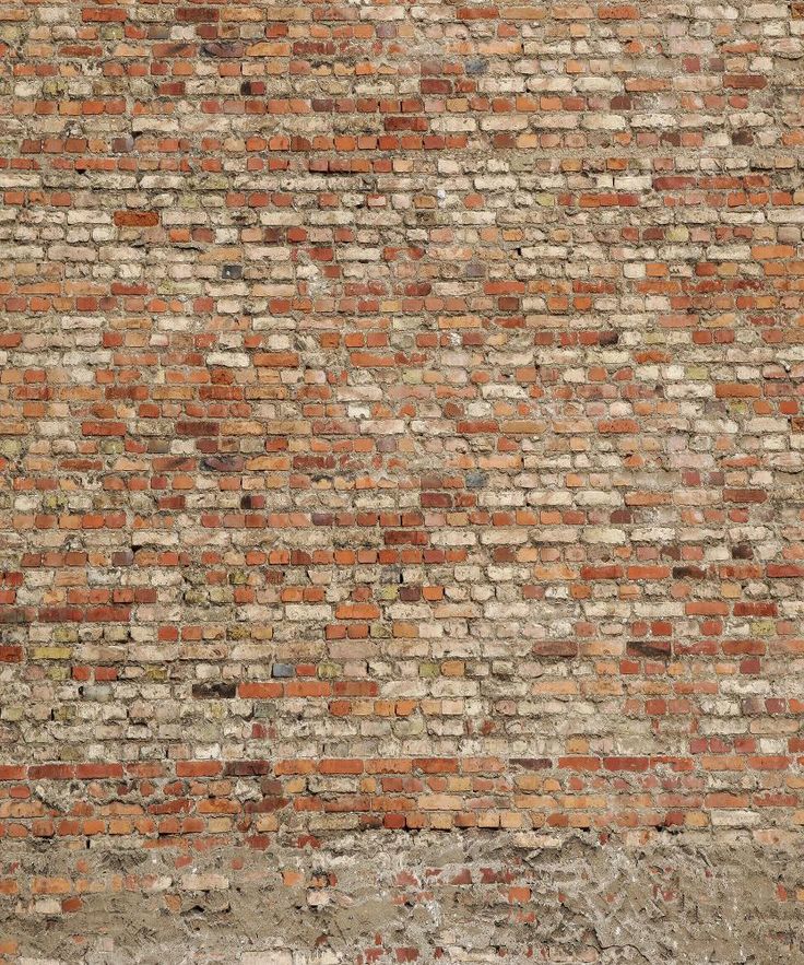 an old brick wall that has been painted red