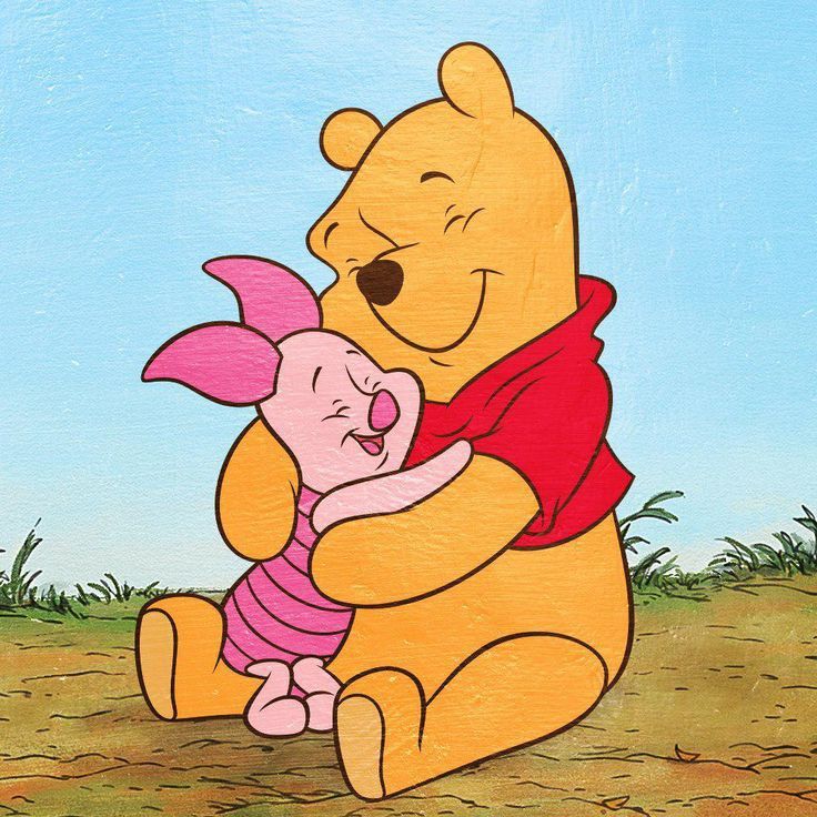 winnie the pooh holding a baby piggy in her arms with grass and blue sky behind