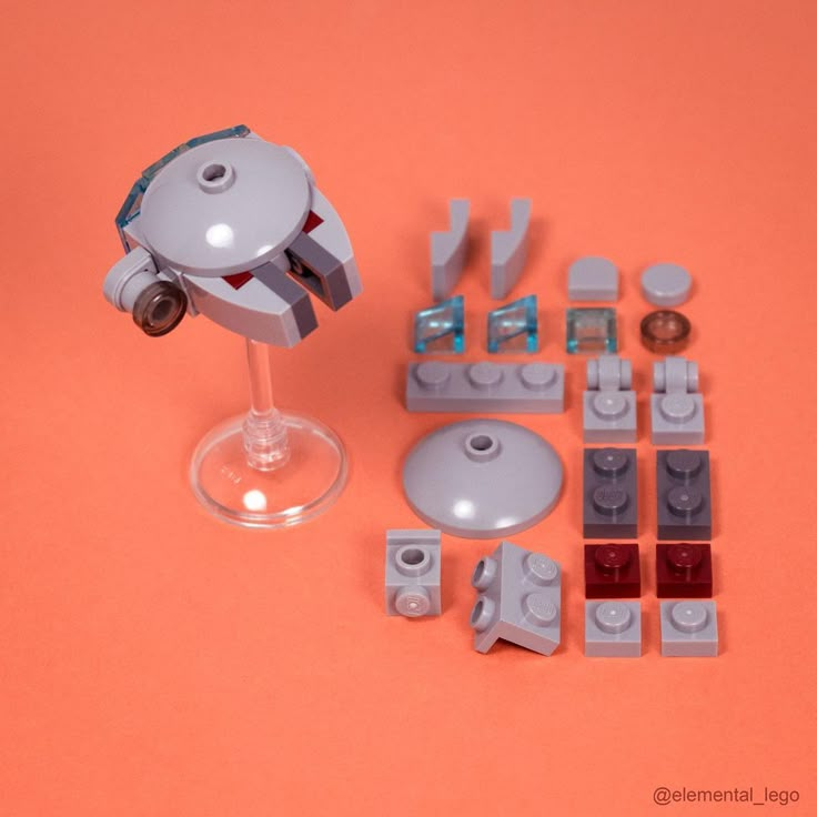 a lego star wars set is shown with its parts and accessories on an orange background