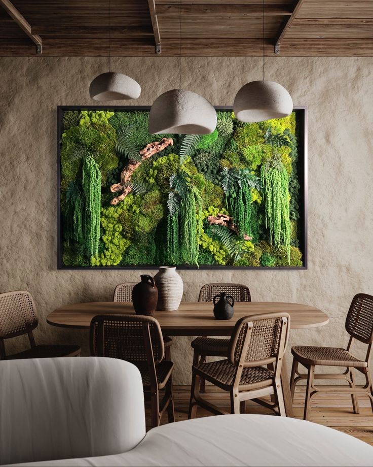 a living room with a table and chairs in front of a painting on the wall