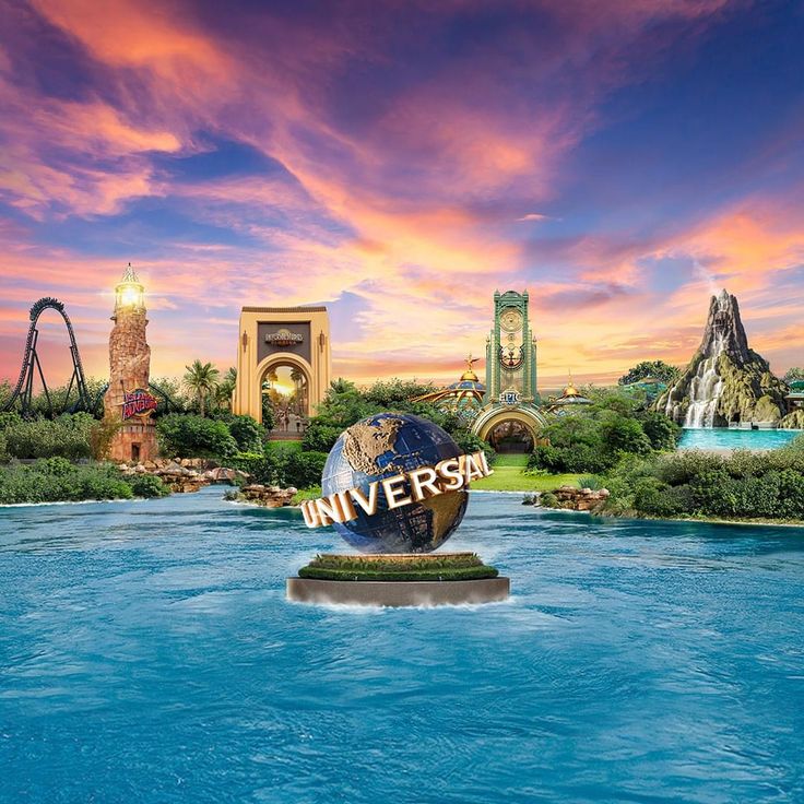 the universal sign is surrounded by water and other attractions in the background at sunset or dawn