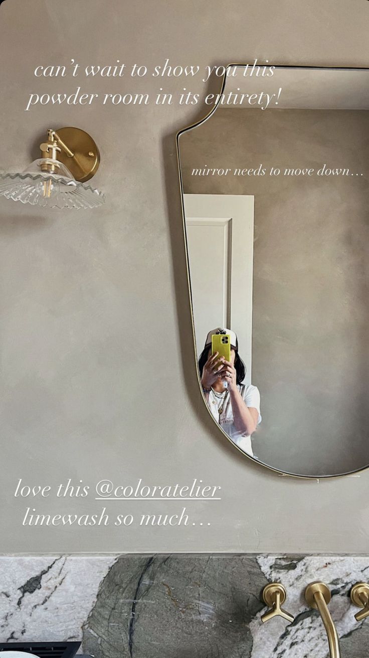 a woman taking a selfie in front of a mirror with the caption, i can't wait to show you the powder room in its glitter