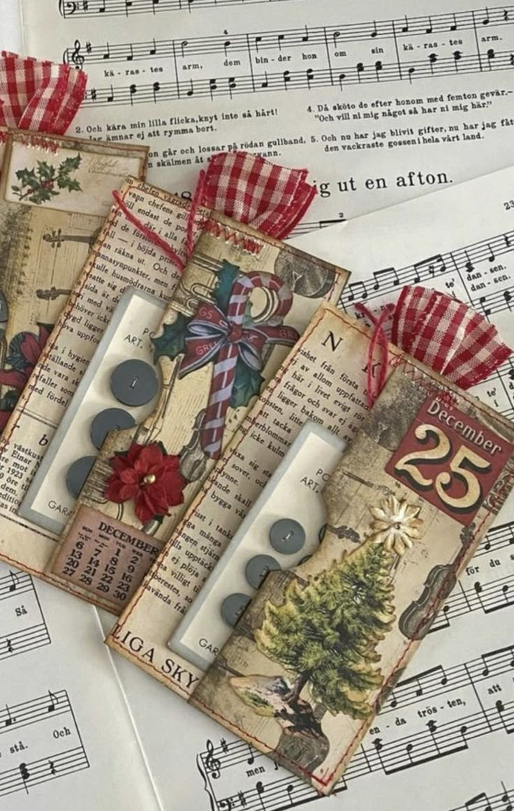 four tags with christmas decorations on them and sheet music notes in the backgroun