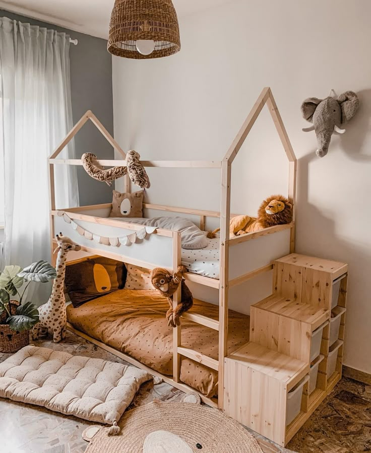 a child's bedroom with bunk beds and stuffed animals