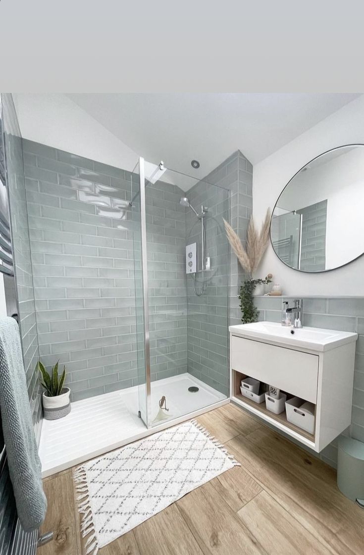 a bathroom with a sink, mirror and shower in it's center piece is shown