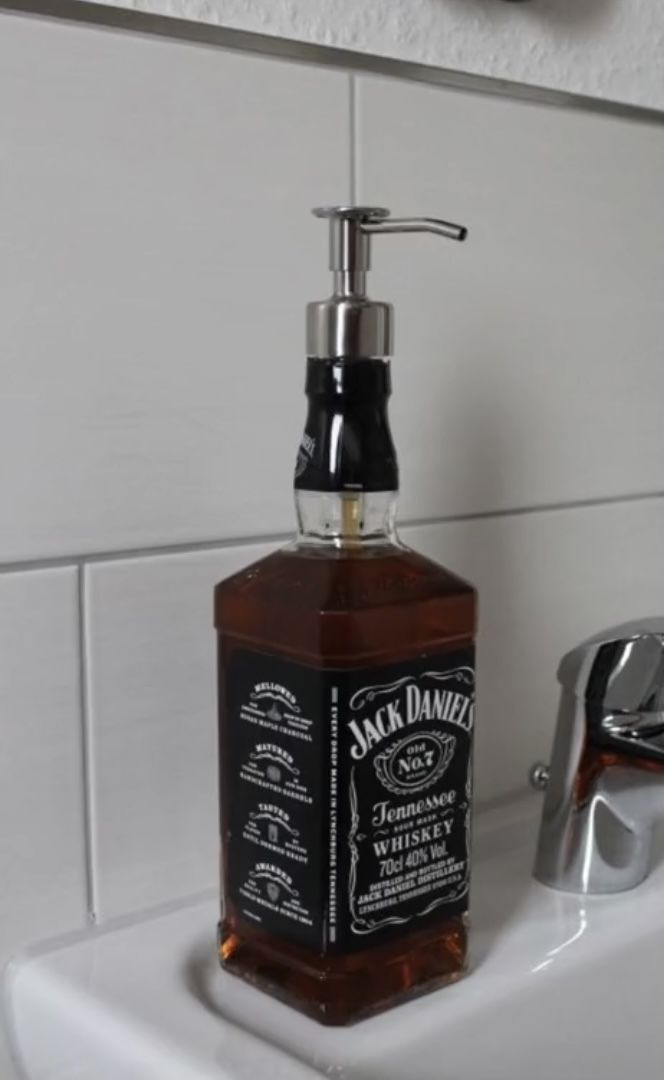 a soap dispenser sitting on top of a sink