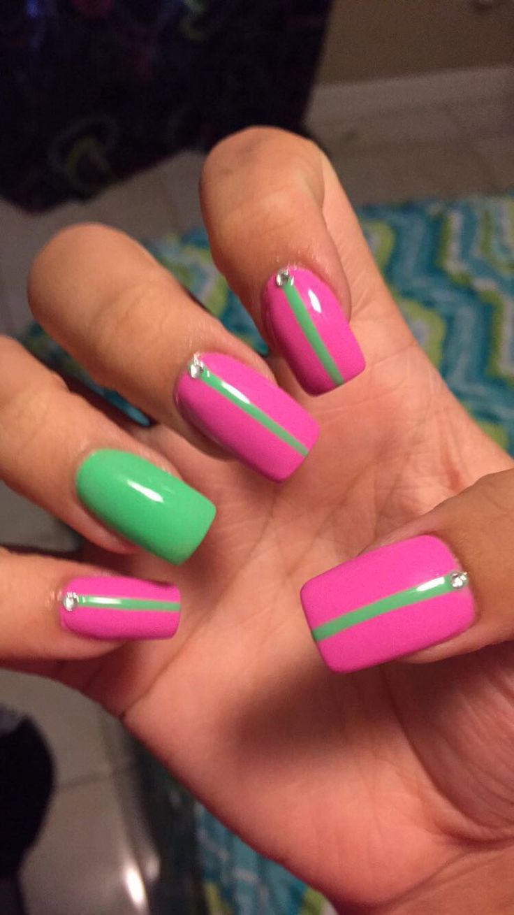 St Patricks Day Nails For Kids, Pink And Green Nails Aka, Pink And Green Dip Nails, Short Pink And Green Nails, Alpha Kappa Alpha Nails, Pink St Patricks Day Nails, Hot Pink And Neon Green Nails, Pink Green Nails Design, Aka Nail Designs