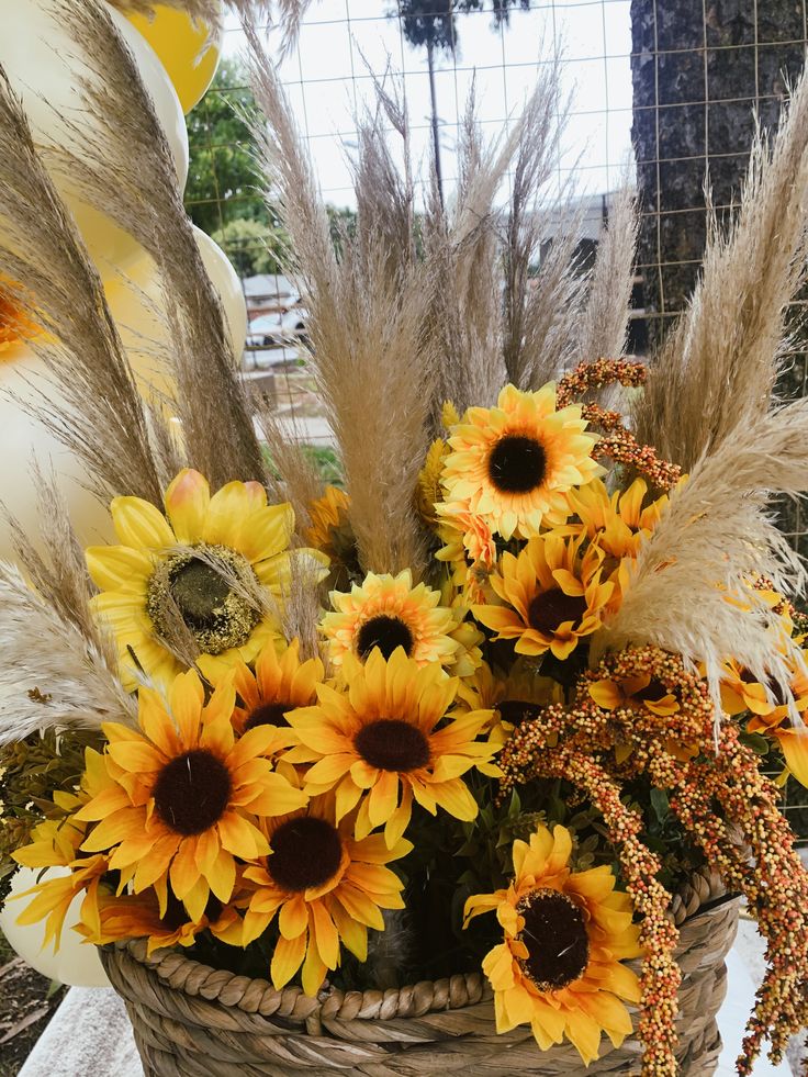 a basket filled with lots of yellow flowers