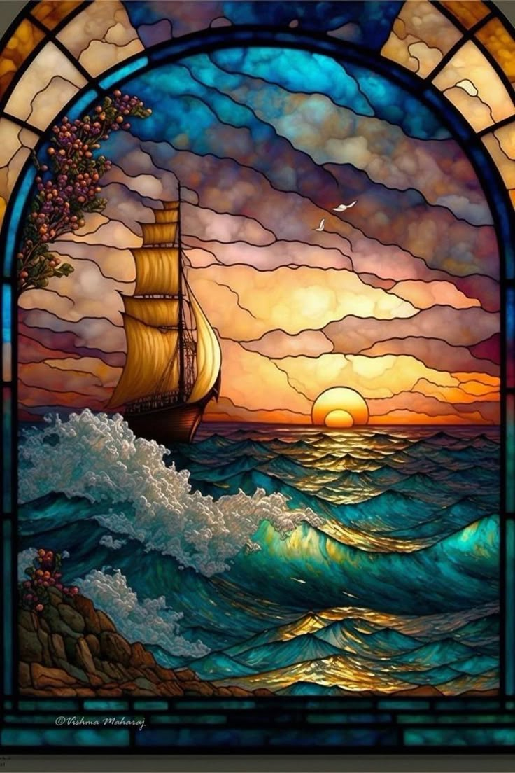 a stained glass window with a sailboat in the ocean and sunsets behind it