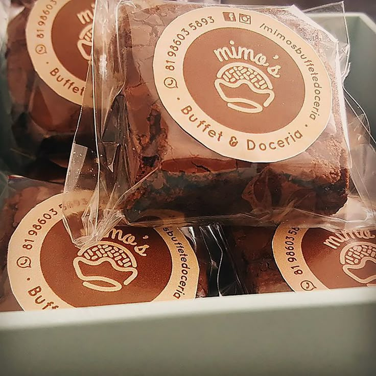 some brownies are wrapped in plastic and have stickers on them to say nourishment