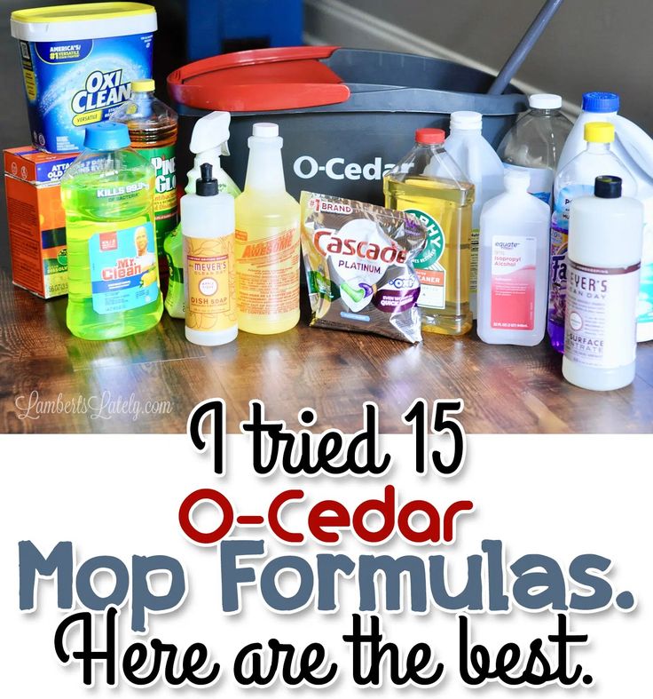 a pile of cleaning products sitting on top of a wooden table