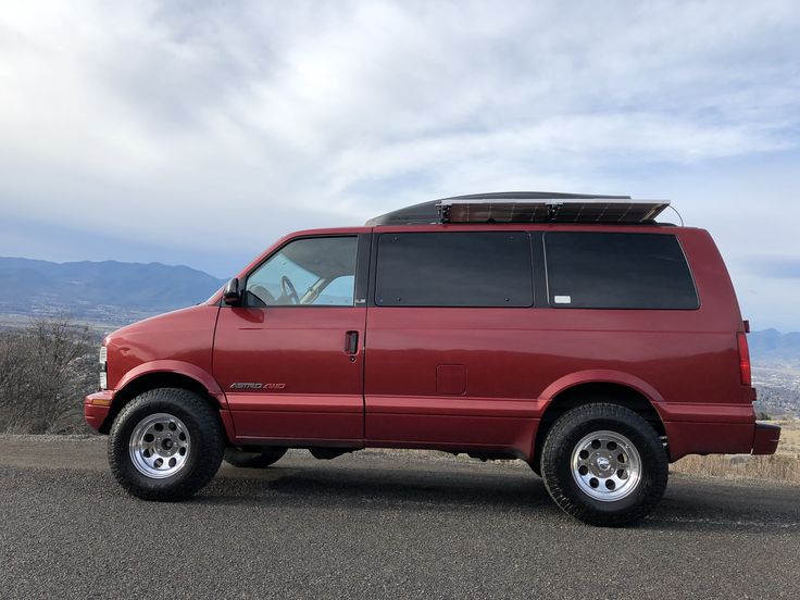 a red van parked on the side of a road