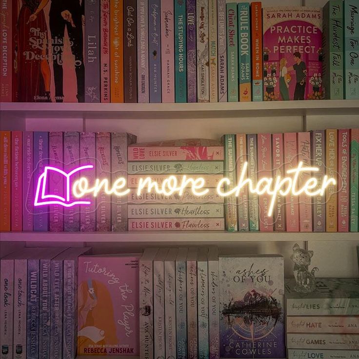 a neon sign that reads one more charter on top of a book shelf filled with books