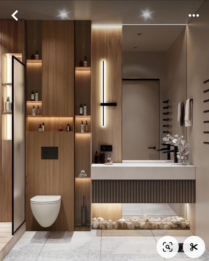 a modern bathroom with wooden cabinets and white porcelain toilet in the center is illuminated by recessed lighting