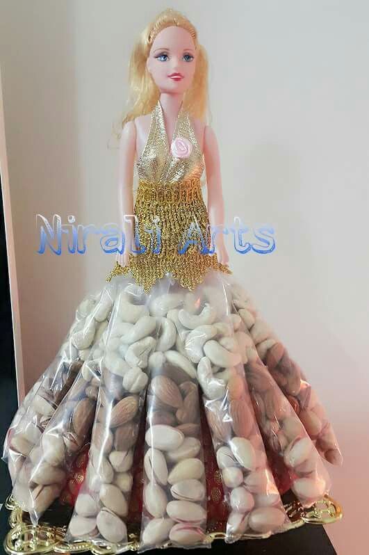 a barbie doll in a dress made out of rocks