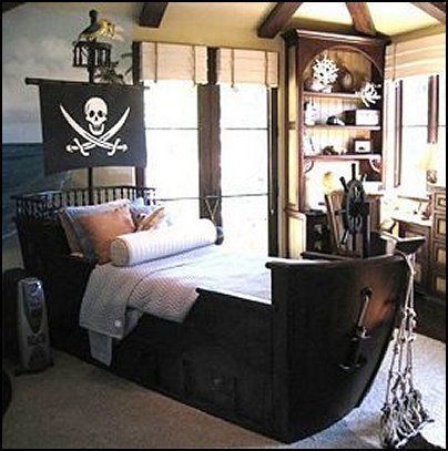 a pirate themed bedroom with an old ship bed