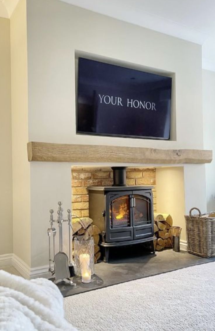 a fireplace with a television above it