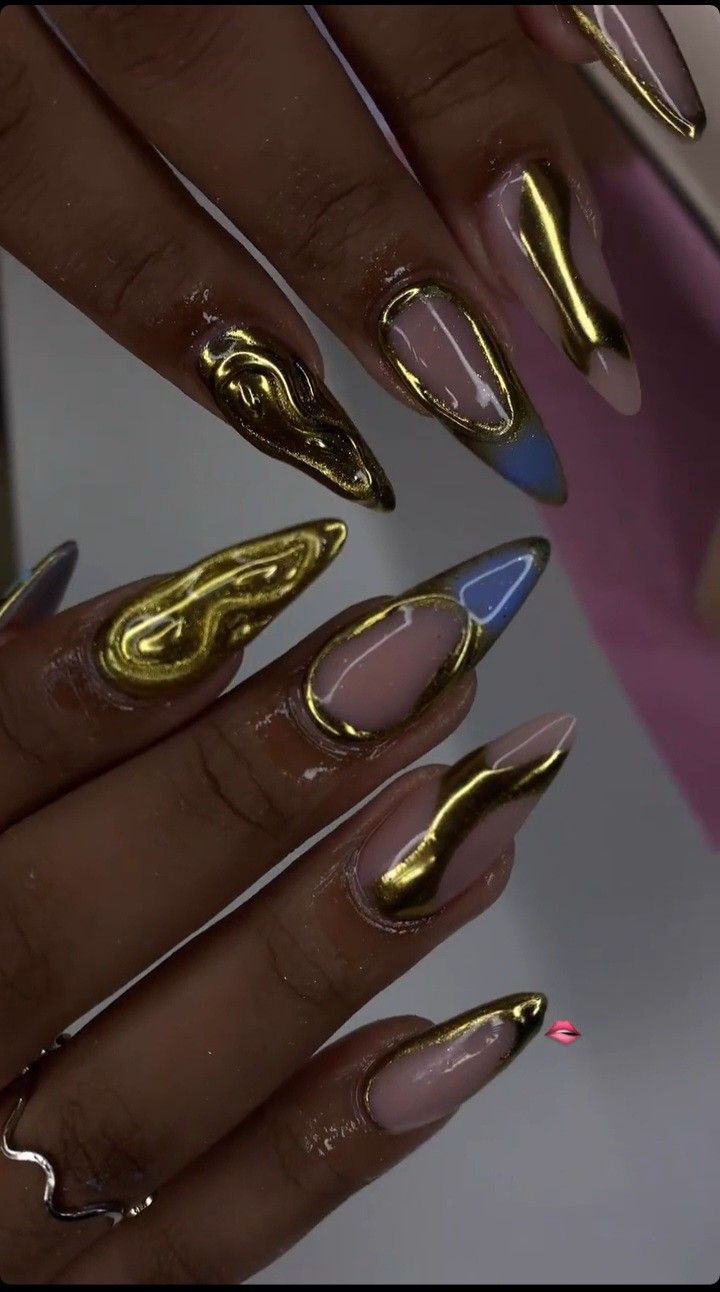 Gold acrylic nails with a hit of blue Baby Blue And Gold Nails, Blue Nail Designs 2024, Gold Blue Nails, Navy Gold Nails, Fall Nails Navy, Light Blue And Gold Nails, Dark Blue And Gold Nails, Gold And Blue Nails, Blue And Gold Nail Designs