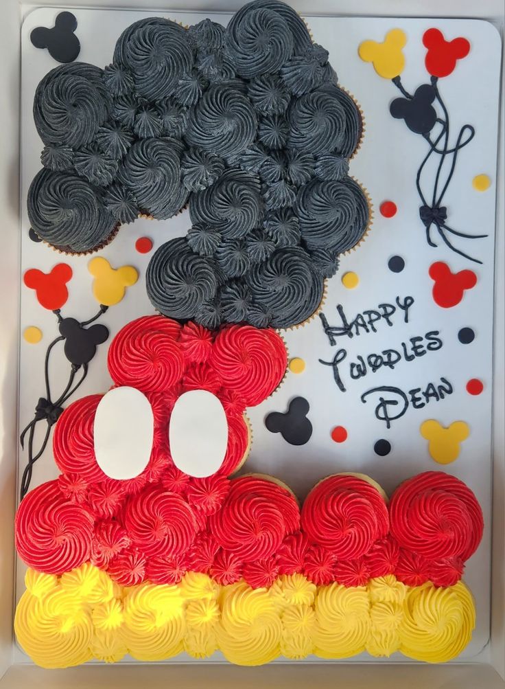 mickey mouse cupcakes are in a box