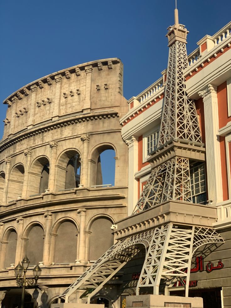 the eiffel tower is in front of some buildings