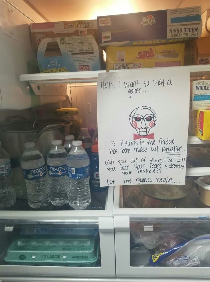 a refrigerator with some water bottles and a sign on the door that says help, i want to plan out