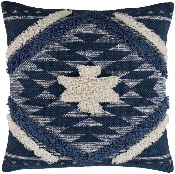 a blue and white pillow with an animal on it's back, in the shape of a diamond