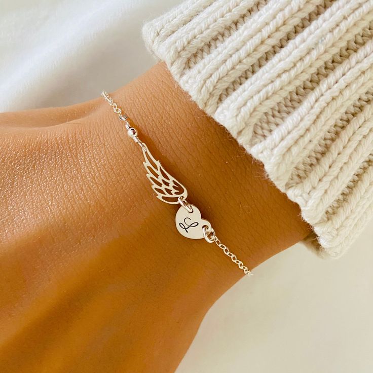 Personalized Angel Wing Heart Disc Bracelet ❤ Available in silver, gold and rose gold. ❤ Specification . Chain and findings are Sterling Silver/ 14K Gold Filled and 14K Rose Gold Filled . Angel Wing is Sterling Silver/ Bronze/ Rose Gold Vermeil size 6 x 14.5mm . Heart Disc size 8.5 x 6.6mm . Comes in a satin pouch . Length includes wing, heart, jump ring and clasp ❤ Memorial Jewelries Album: https://www.etsy.com/au/shop/StampedEve?ref=simple-shop-header-name&listing_id=468603715&sort_order=date_ Angel Wings Craft Jewellery My Family Are My Abgels, Affordable Personalized White Heart Bracelet, Angel Heart Gifts, Memorial Bracelet Ideas, Grandpa Memorial, Angel Wings Bracelet, Memorial Gift Ideas, Memorable Jewelry, Angel Wing Bracelet