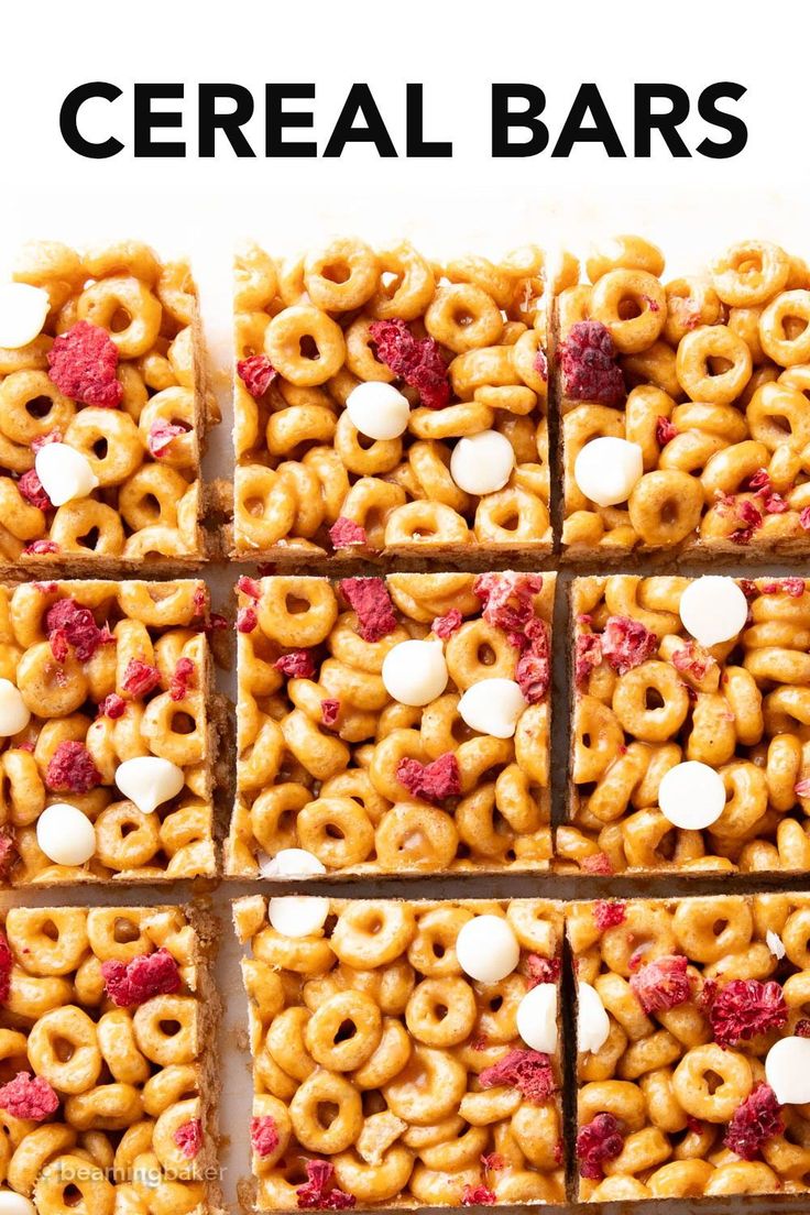 cereal bars with marshmallows and raspberries arranged in squares on top