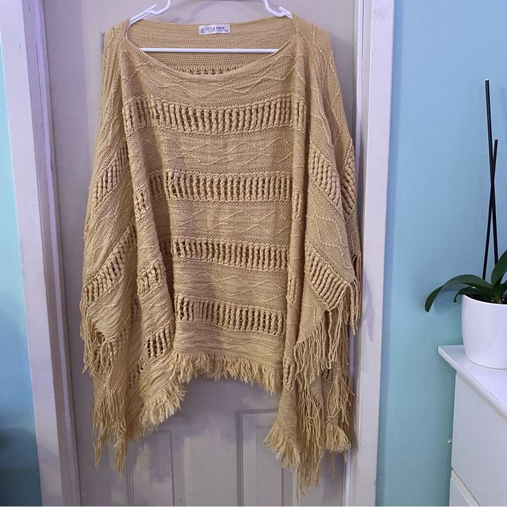 Super Cute Tan Mustard Yellowish Poncho Perfect For All Seasons And Boho Style!! Size Os Really Big And Roomy Fits Me As An Xl Would Definitely Fit 1x Maybe Even 2x Length Measurements Are 27inches Perfect For Warm Fall Days Winter Or Beach Cover Ups Bundle And Save!! Items May Come With Few Stray Cat Hairs I Try My Best To Clean Them Before Shipping Any More Questions Please Ask!! Price Firm!!!!!!!!!!!! Beige Knitted Sweater For Vacation, Beige Crochet Top For Fall Vacation, Cream Sweater For Beach In Fall, Bohemian Beige Knit Sweater, Beige Bohemian Sweater With Textured Knit, Beige Bohemian Open Knit Sweater, Beige Bohemian Textured Knit Sweater, Bohemian Beige Textured Knit Sweater, Beige Crochet Poncho For Fall