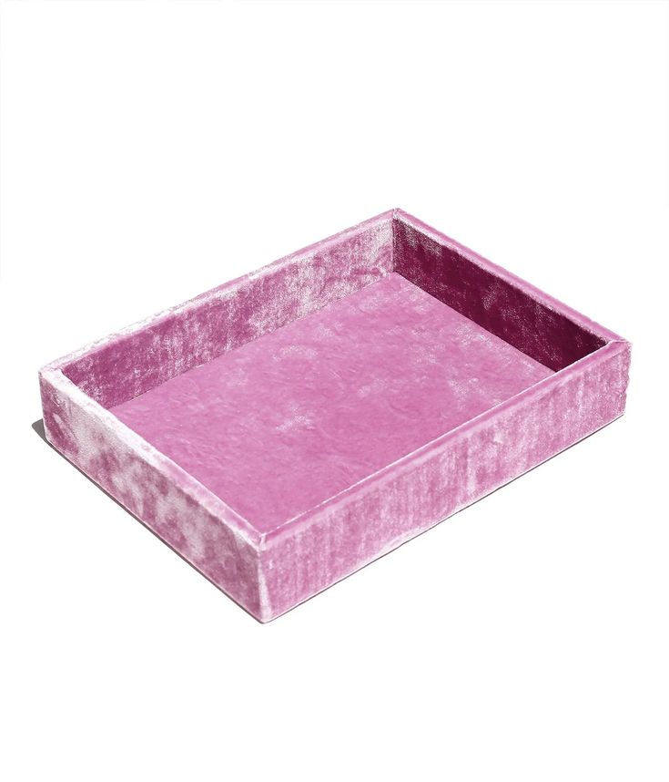 a pink velvet tray on a white background