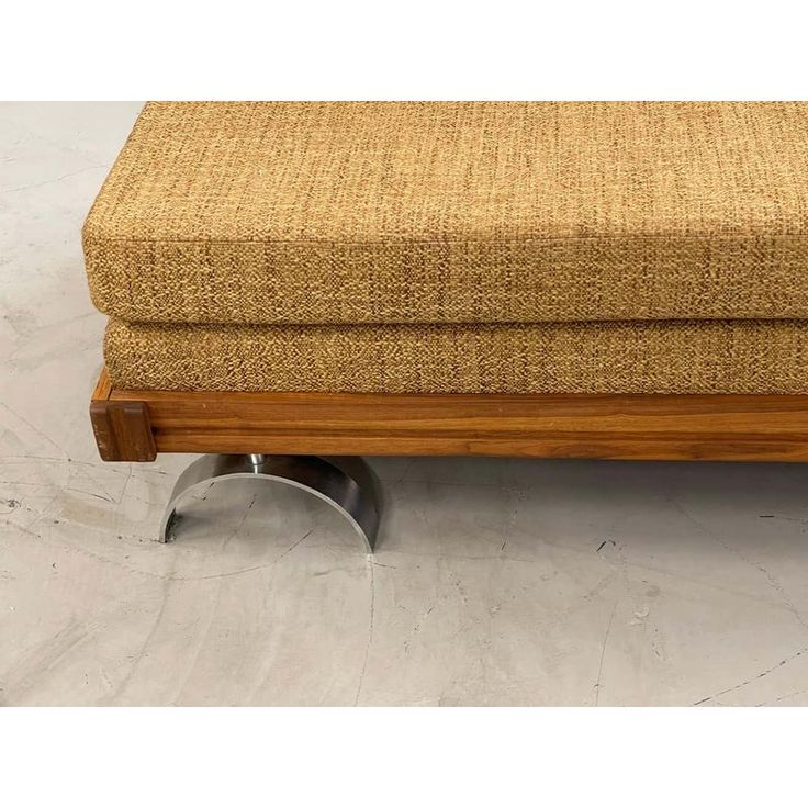 a footstool that is made out of wood and metal