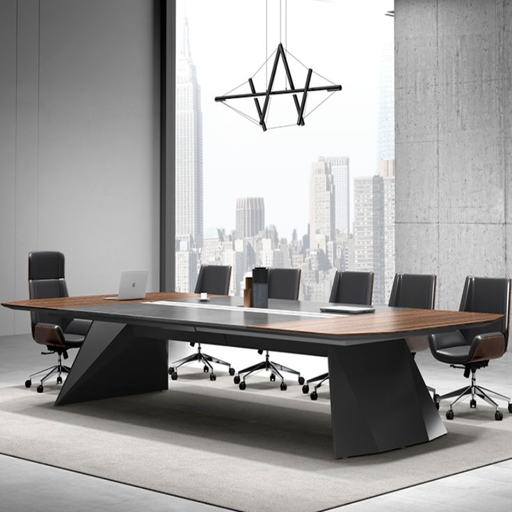 a conference table with black chairs in front of a large window