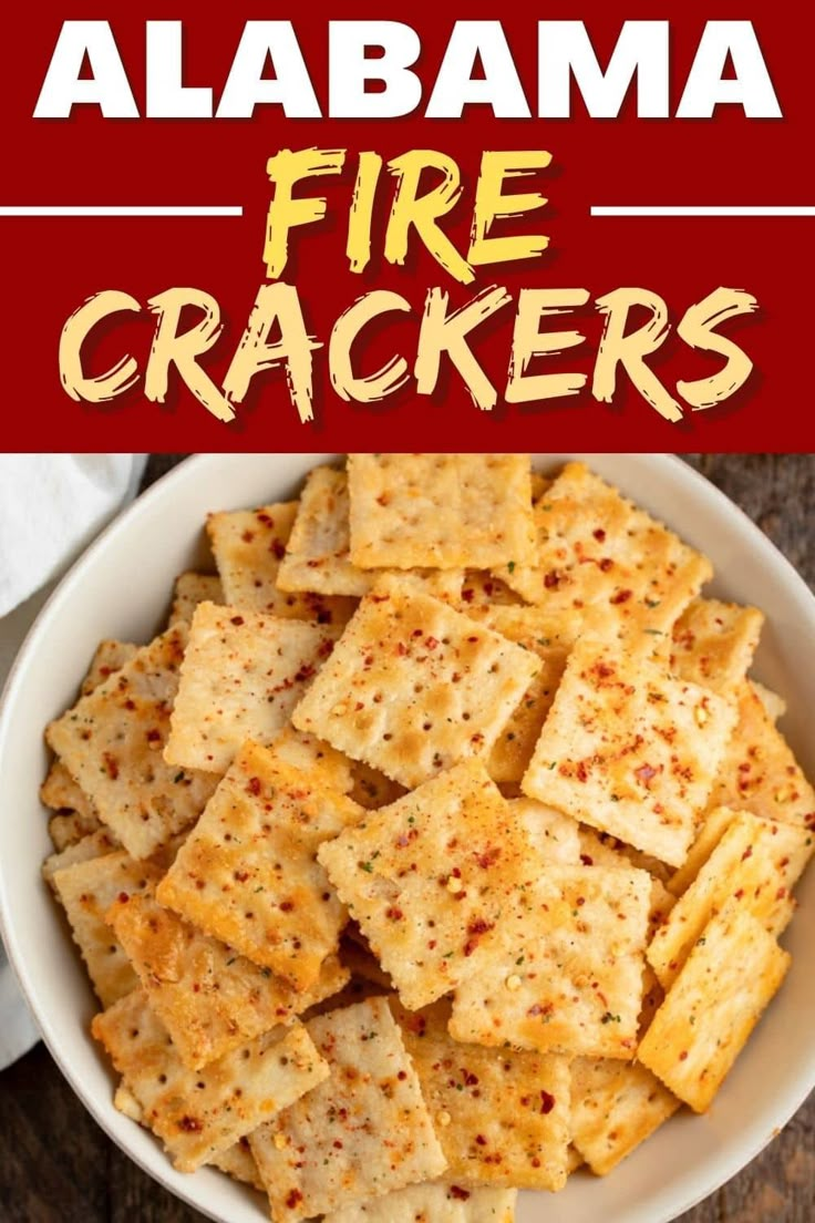 a white bowl filled with crackers on top of a wooden table next to a red sign