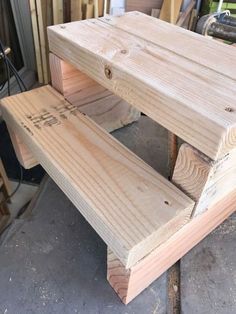 two wooden benches sitting next to each other