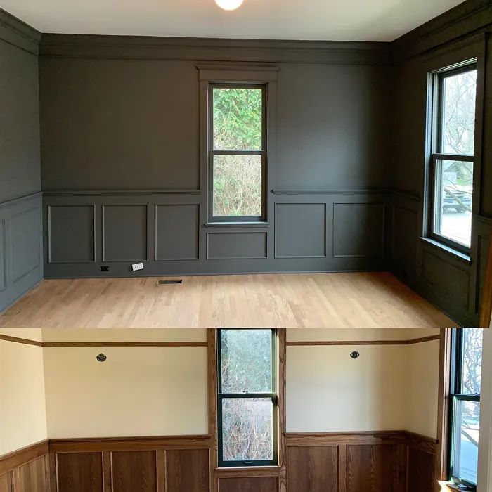 an empty room with wood paneling and windows