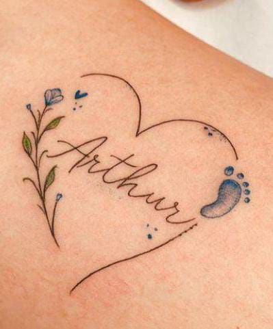 a tattoo with the word faith on it and a baby's foot in the shape of a heart