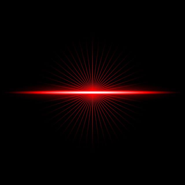 a red light shines brightly in the dark, creating a starburst effect