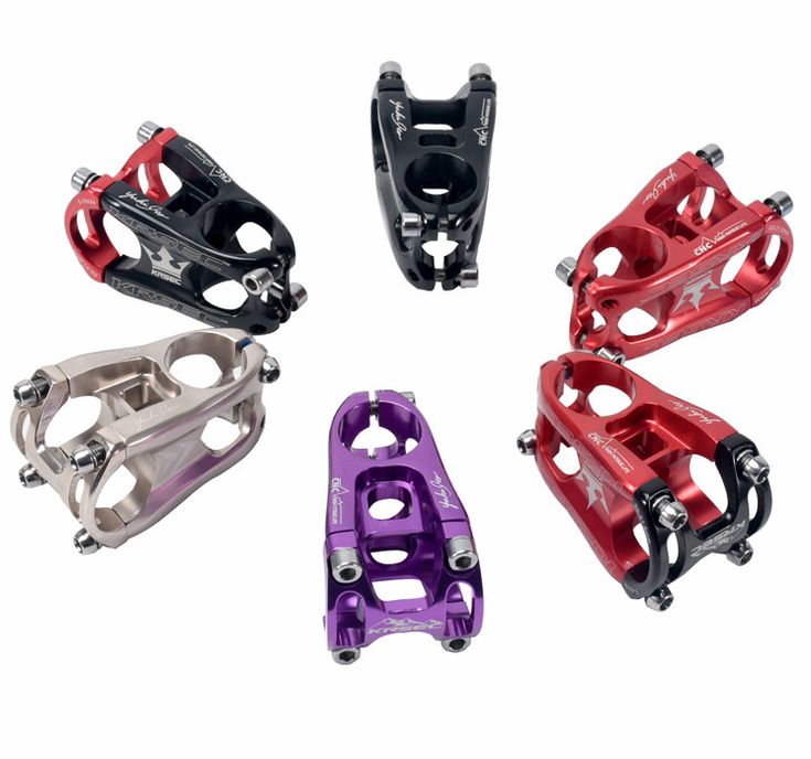 four different types of bicycle pedals in various colors