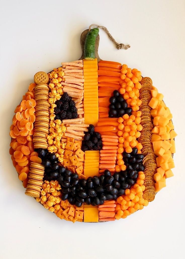 a pumpkin made out of crackers and vegetables