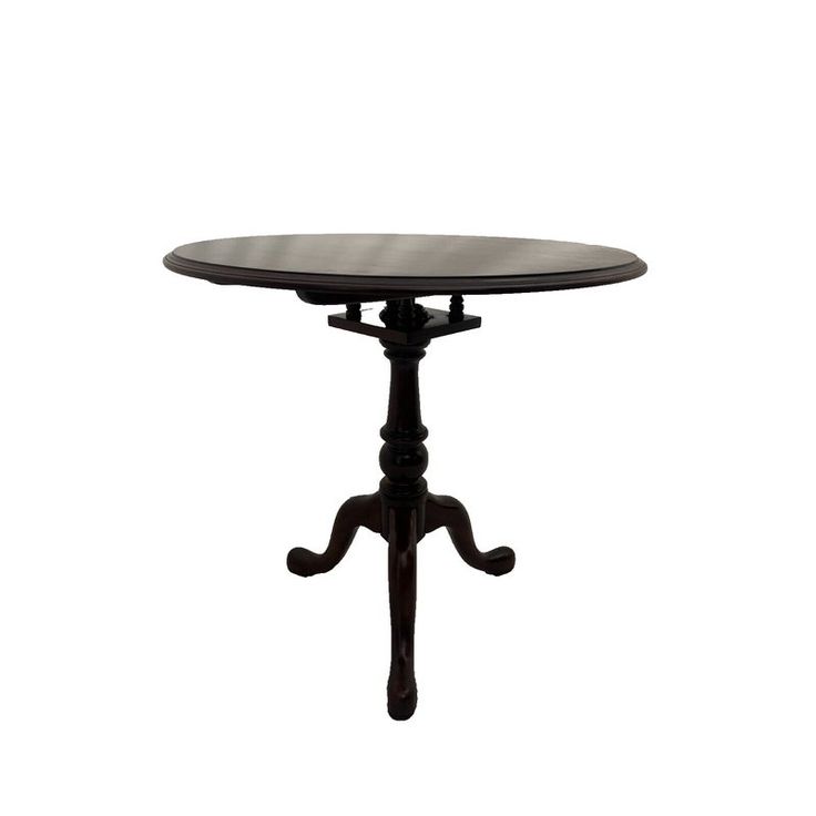 a black table with an ornate design on the top and base, against a white background