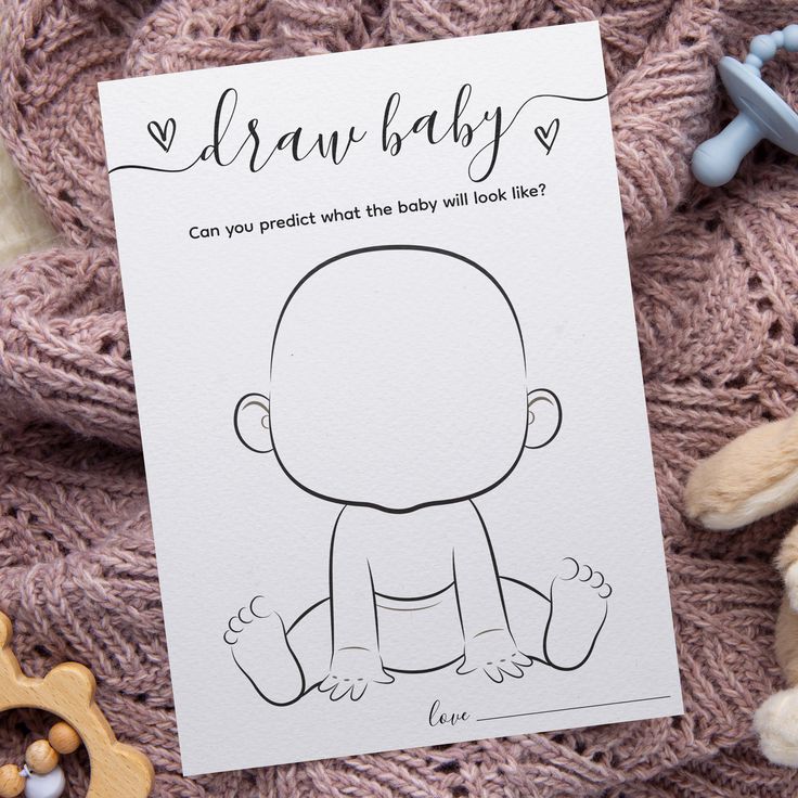 a card with a drawing of a baby on it next to some teddy bears and other toys