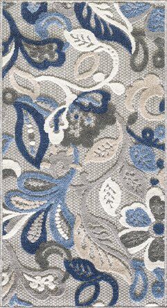 a blue and white paisley design on a gray ground cloth with an intricate pattern in the center