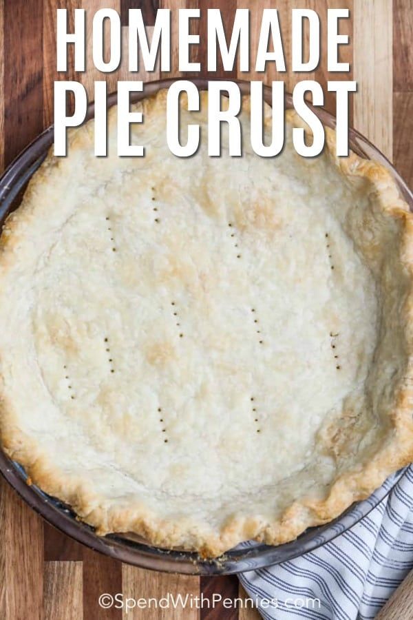 homemade pie crust in a pie pan with text overlay that reads homemade pie crust