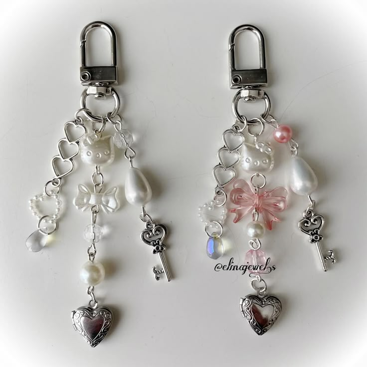 two key chains with charms attached to them