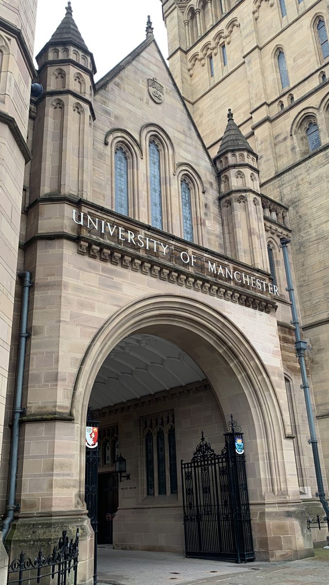 the front entrance to an old stone building